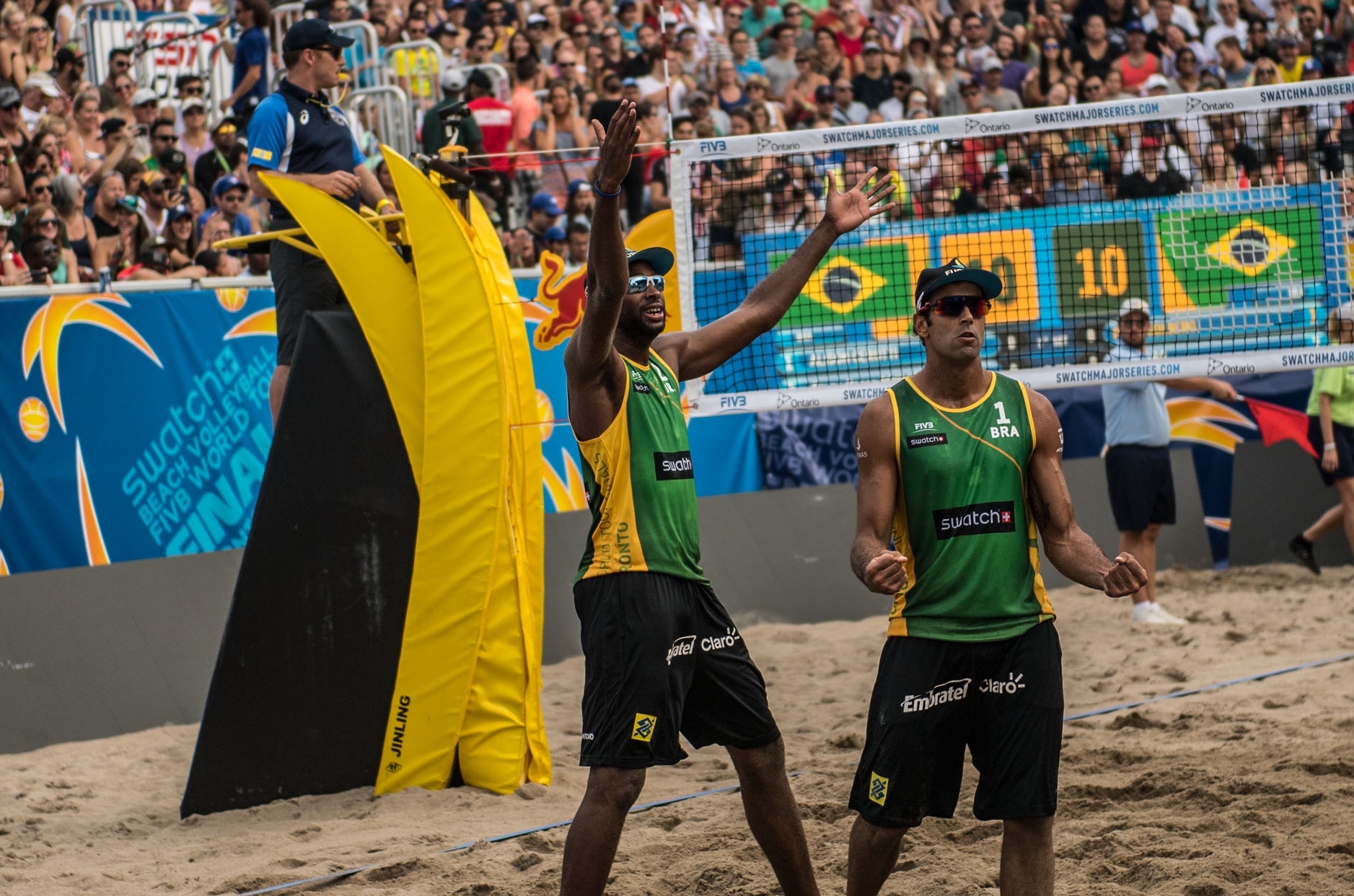 Pedro Solberg and Evandro celebrate during the gold medal match